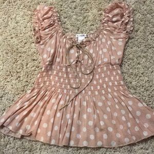 Light pink and white polka dot blouse